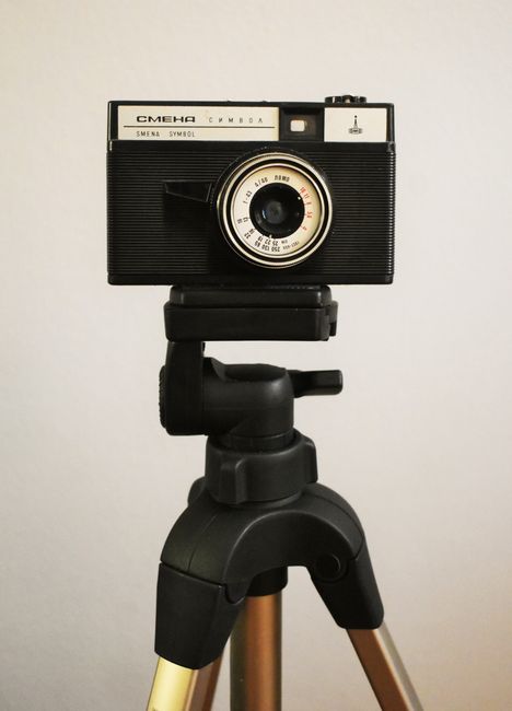 A classic Smena camera mounted on a tripod, perfect for vintage and photography enthusiasts.