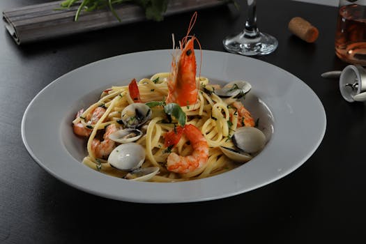 Delicious seafood pasta with shrimps and clams in a classy setting.