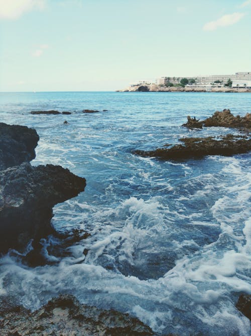 Rough waves splashing on rocks