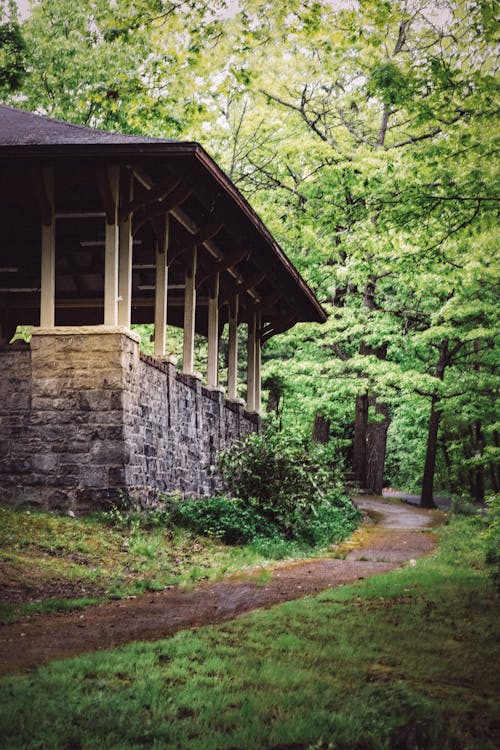 A small stone building in the woods