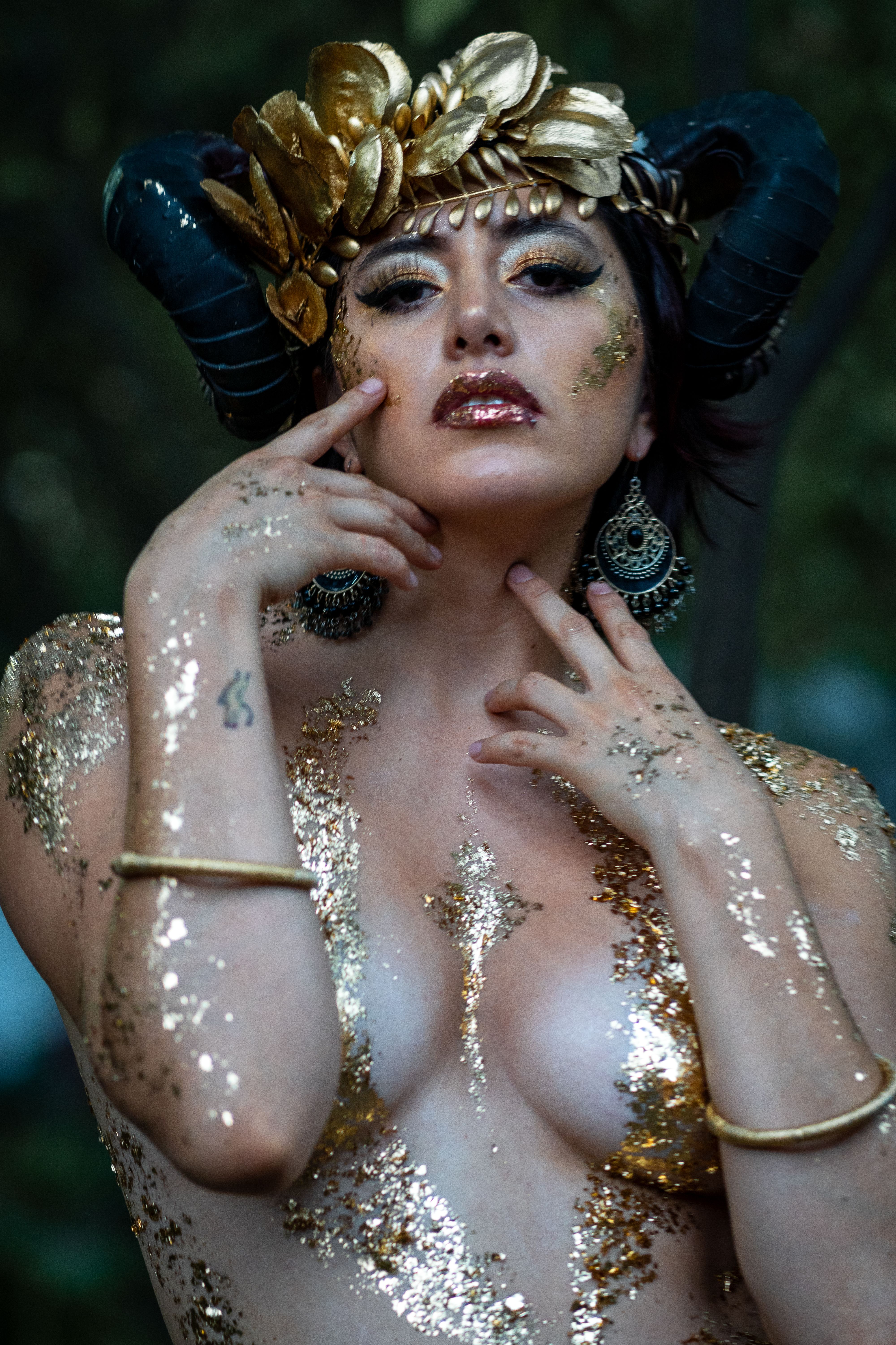 A woman in gold and gold body paint · Free Stock Photo