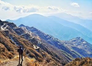 Photo of Man Standing Near Cliff Edge