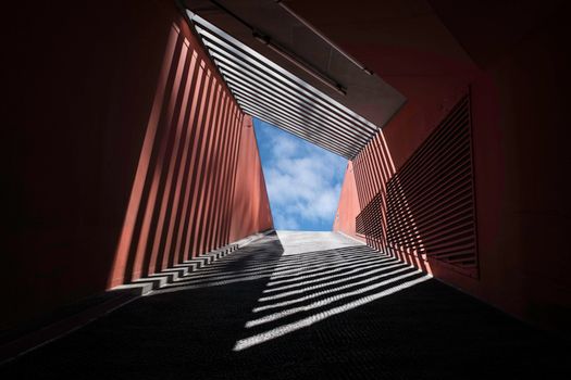 Captivating shadows and light create an abstract pattern in a Hamburg tunnel.