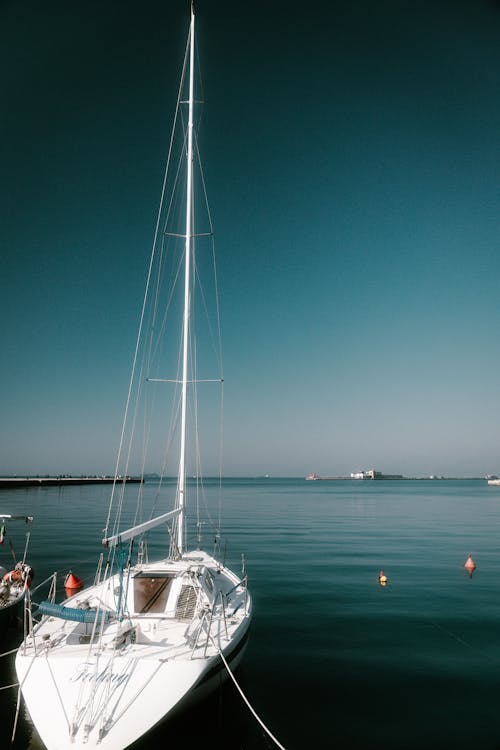 A sailboat is docked in the water