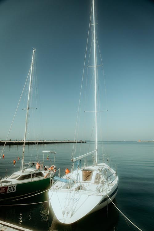 Two boats docked at a dock