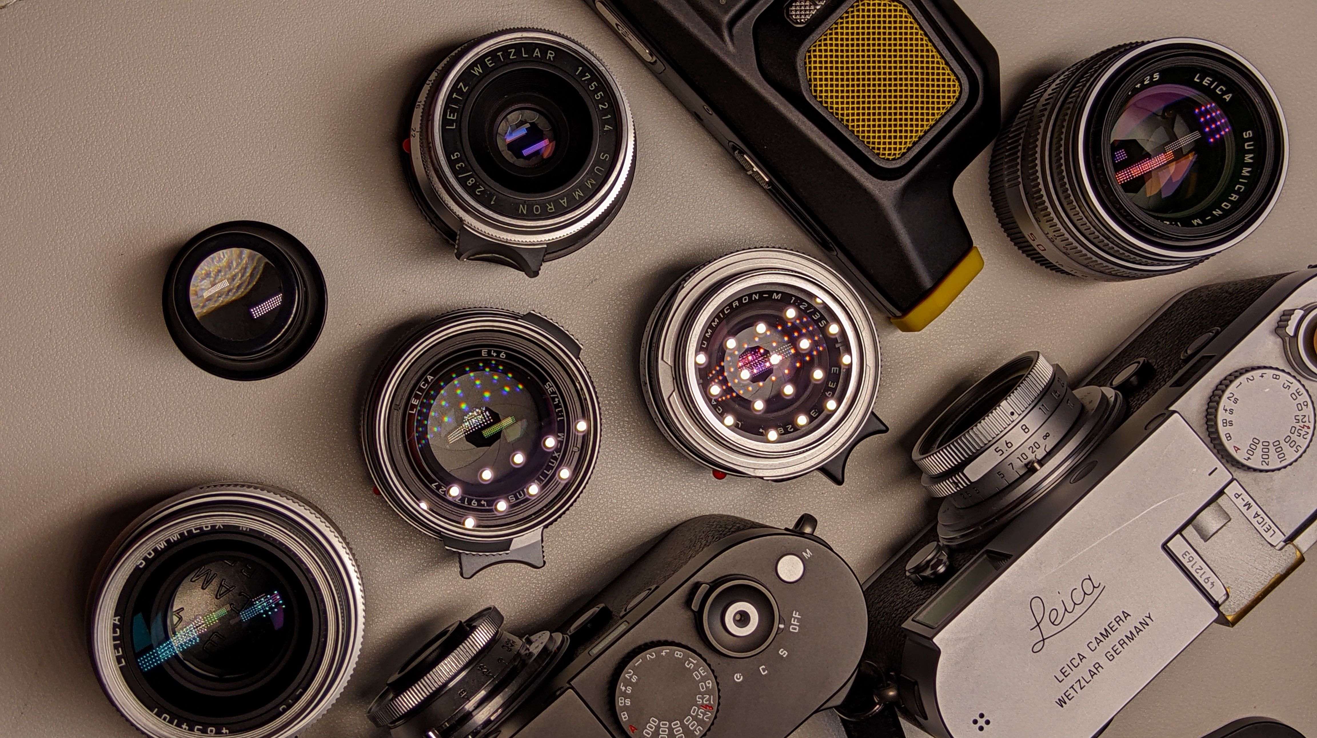 Top view of classic camera and lenses set with retro design elements.