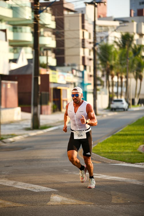 A man running on the street in a triathlon