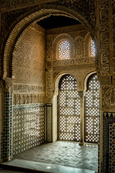Stunning Moorish architectural design inside the Alhambra with intricate mosaic and stone work.