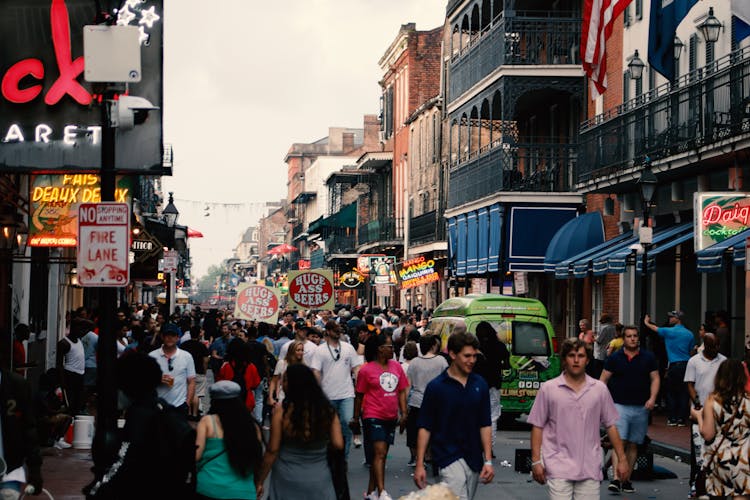 People Walking On Paved Road