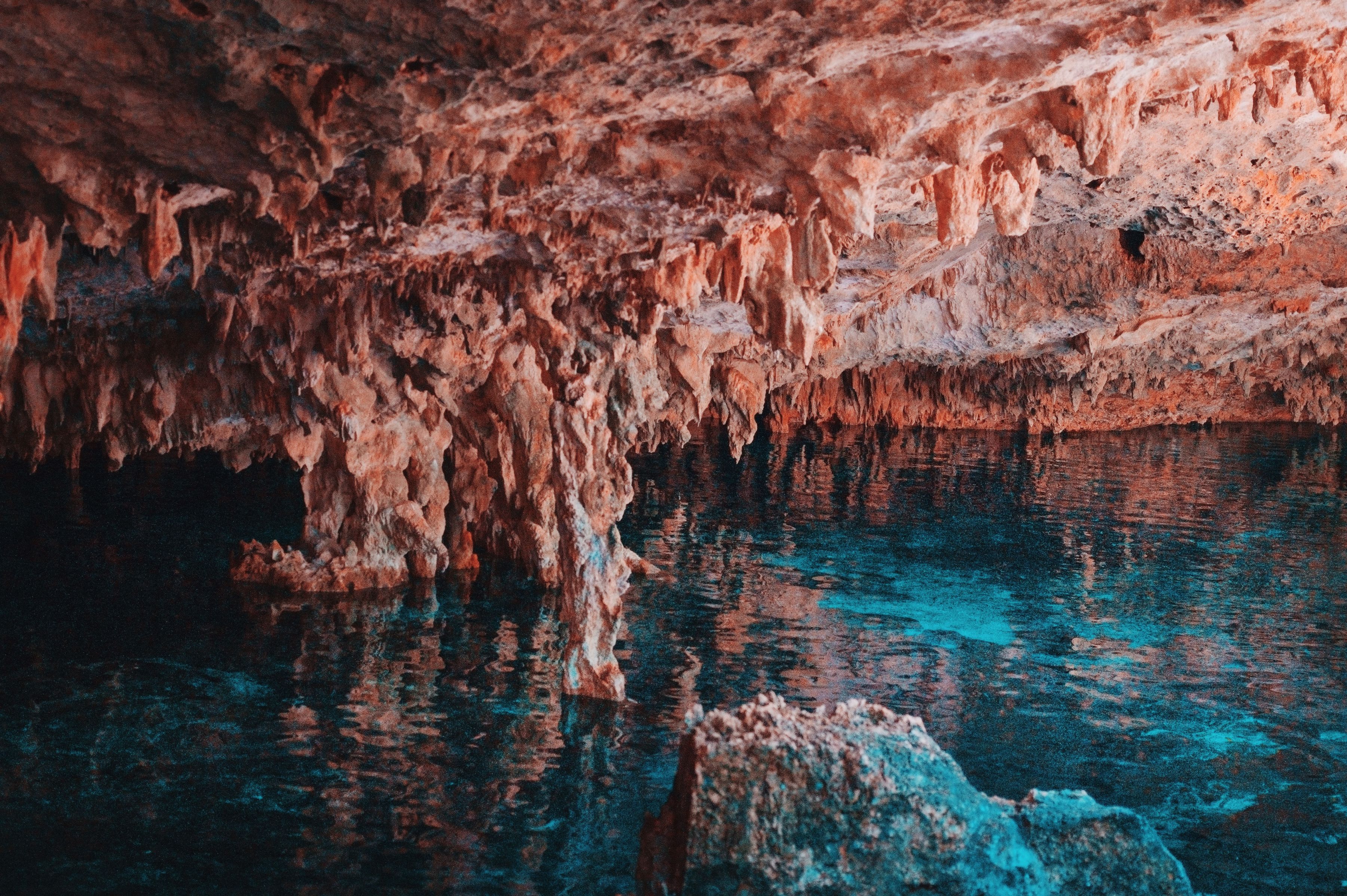 Limestone formations and fresh water inside a Mexican cenote cave