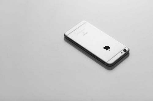 Free Elegant minimalist image of a smartphone on a white background. Stock Photo