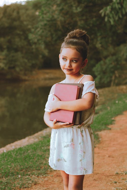 Free Girl Carrying Books Stock Photo