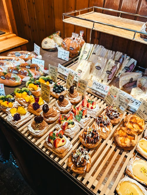 A display of pastries and breads on a wooden table