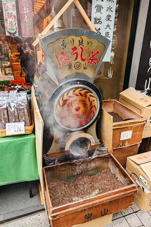 A steam machine is on display in front of a store