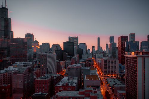Free Stunning view of Chicago's skyline during sunset, showcasing iconic skyscrapers and urban architecture. Stock Photo