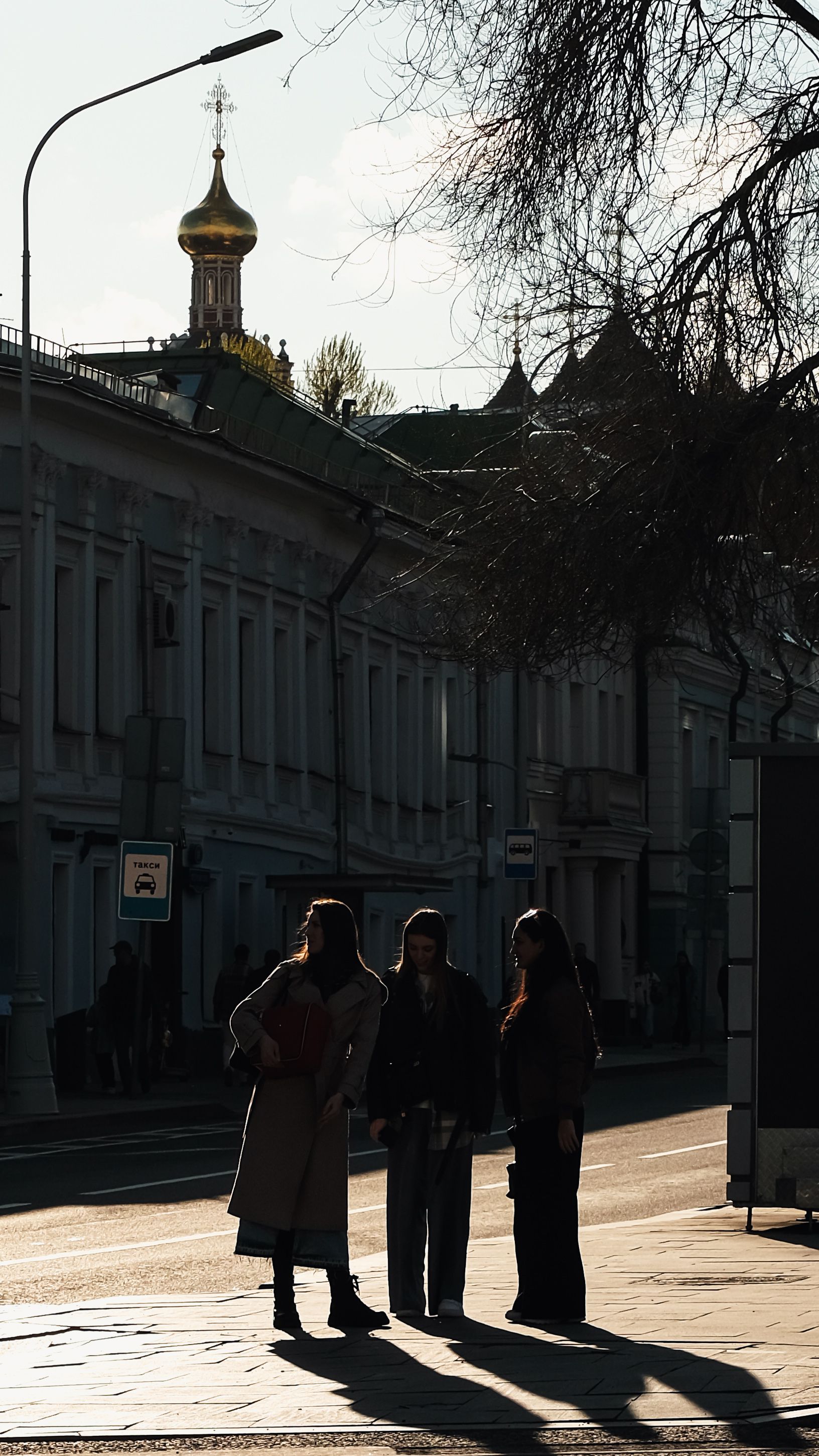 A Group of Women Standing on a Sidewalk in a City · Free Stock Photo