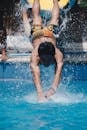 Man Jumping Towards Pool