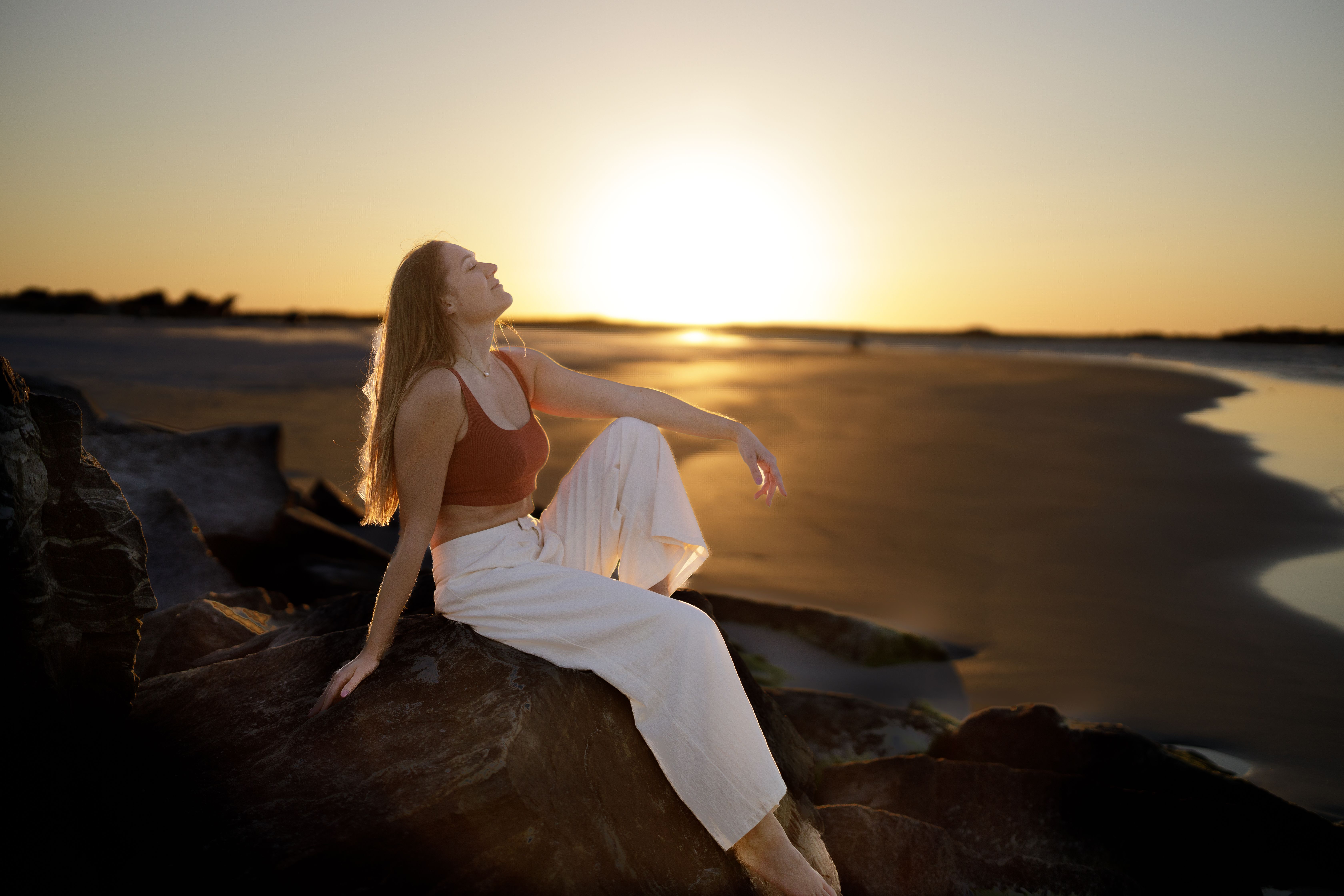 Woman Relaxing at Sunset on New Smyrna Beach · Free Stock Photo