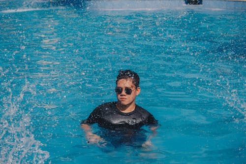 Free Man Swimming on Pool Stock Photo