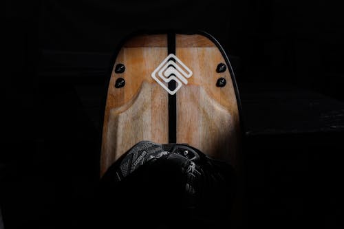 A wooden board with a logo on it