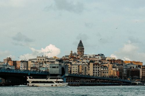 Free Explore the bustling cityscape of Istanbul with the iconic Galata Tower overlooking the sea. Stock Photo