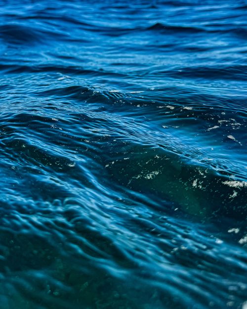 Free Dynamic and vivid blue ocean waves captured in Passagem, Rio de Janeiro, Brazil. Stock Photo