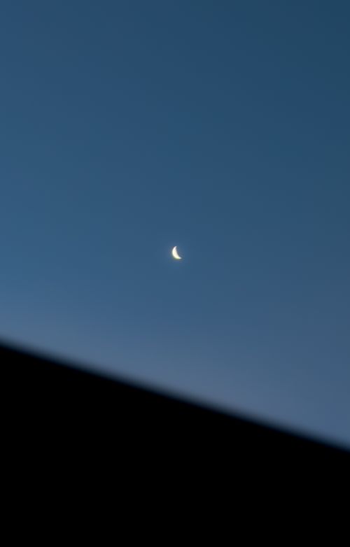 Free A serene night sky featuring a crescent moon above Vila Nova, Brazil. Stock Photo