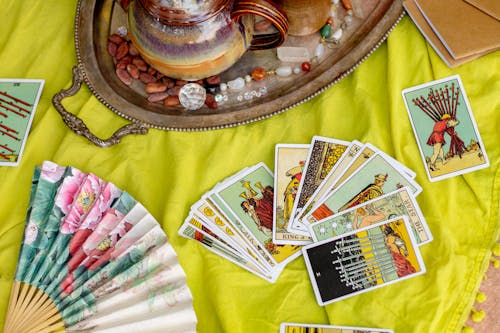 Tarot Cards, Fan & Teapot on Yellow Blanket Landscape