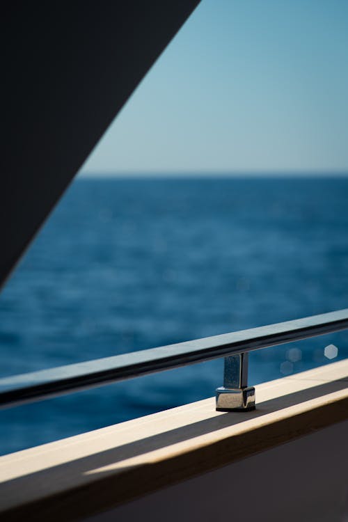 A view of the ocean from a balcony on a boat