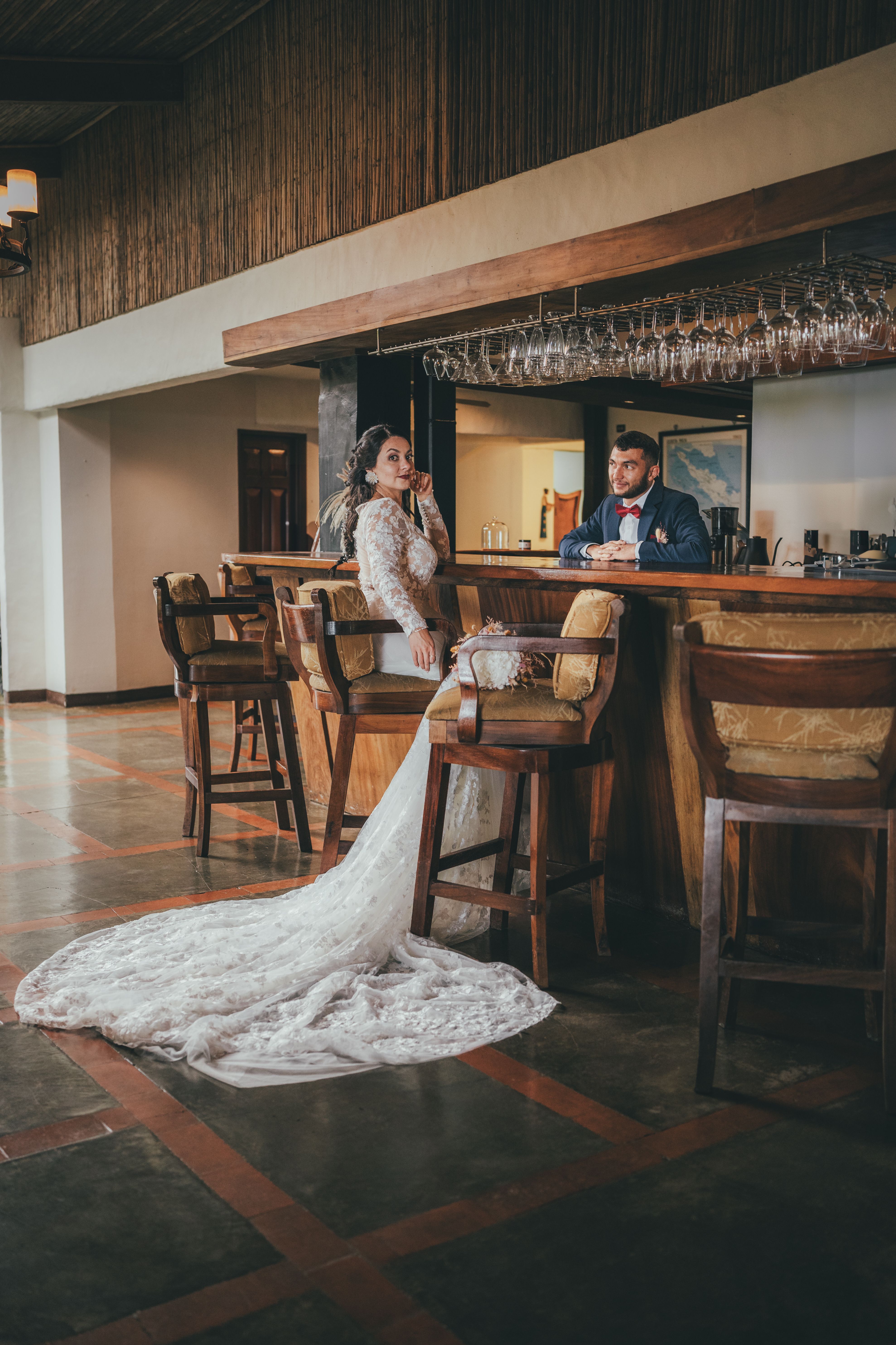 The Bride and Groom Sitting at the Bar · Free Stock Photo