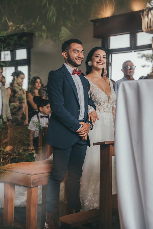 A bride and groom standing at the altar