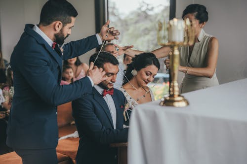 A bride and groom are getting married in a church