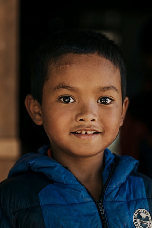 Boy Wearing Blue and Black Jacket