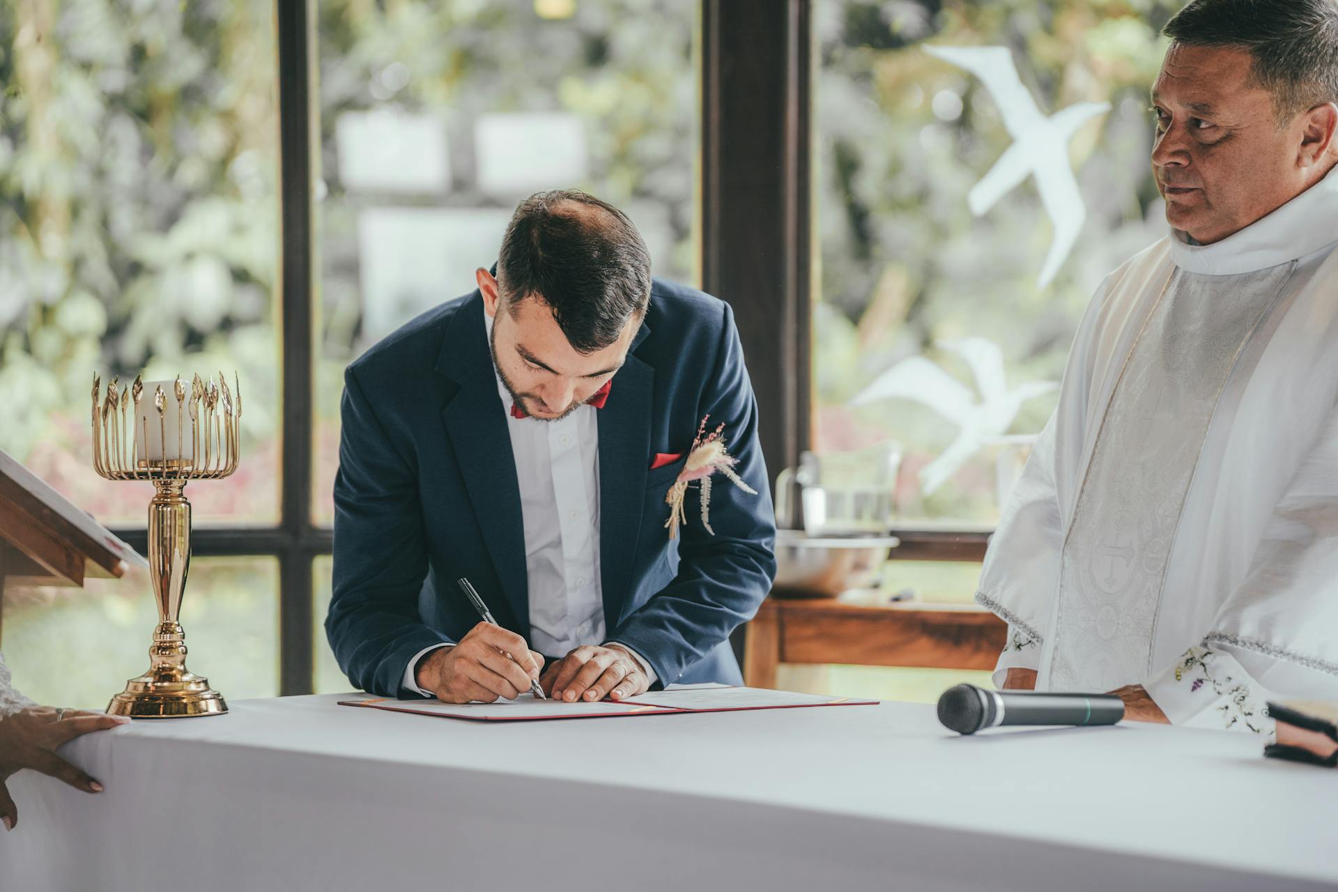 Groom Signing Marriage License