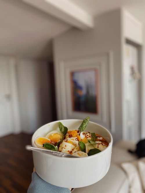 Free A fresh egg salad with basil and spices in a white bowl, perfect for a healthy meal. Stock Photo
