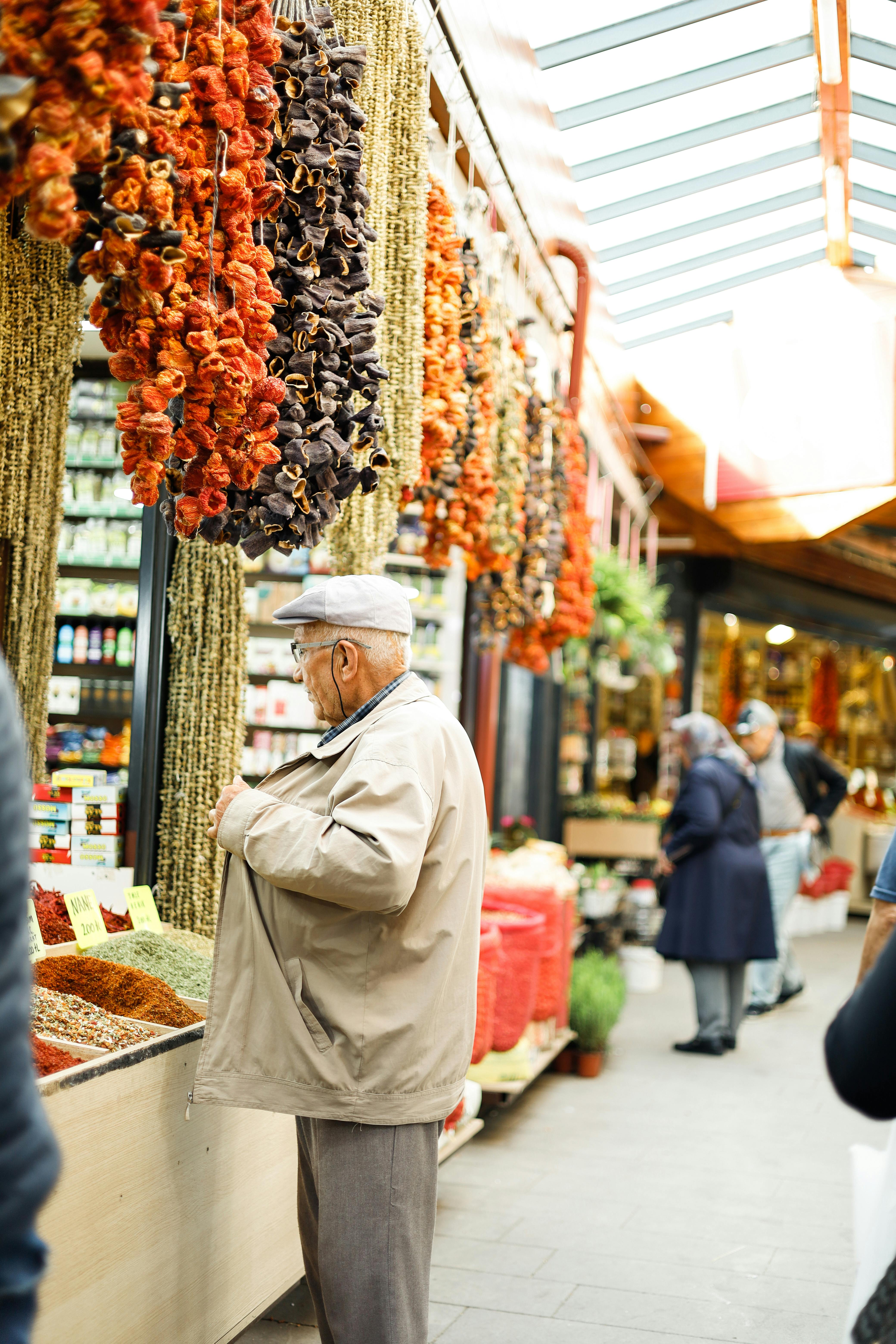 elderly man shopping at bazaar