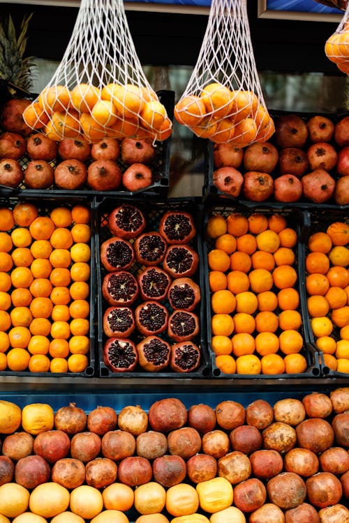 A display of oranges and other fruits for sale