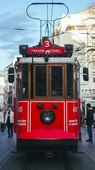 Front view of the iconic Taksim Tünel tram in Istanbul, capturing urban life.