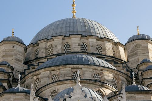 Free Close-up of the ornate domes of the New Mosque in Istanbul, showcasing Ottoman architecture. Stock Photo
