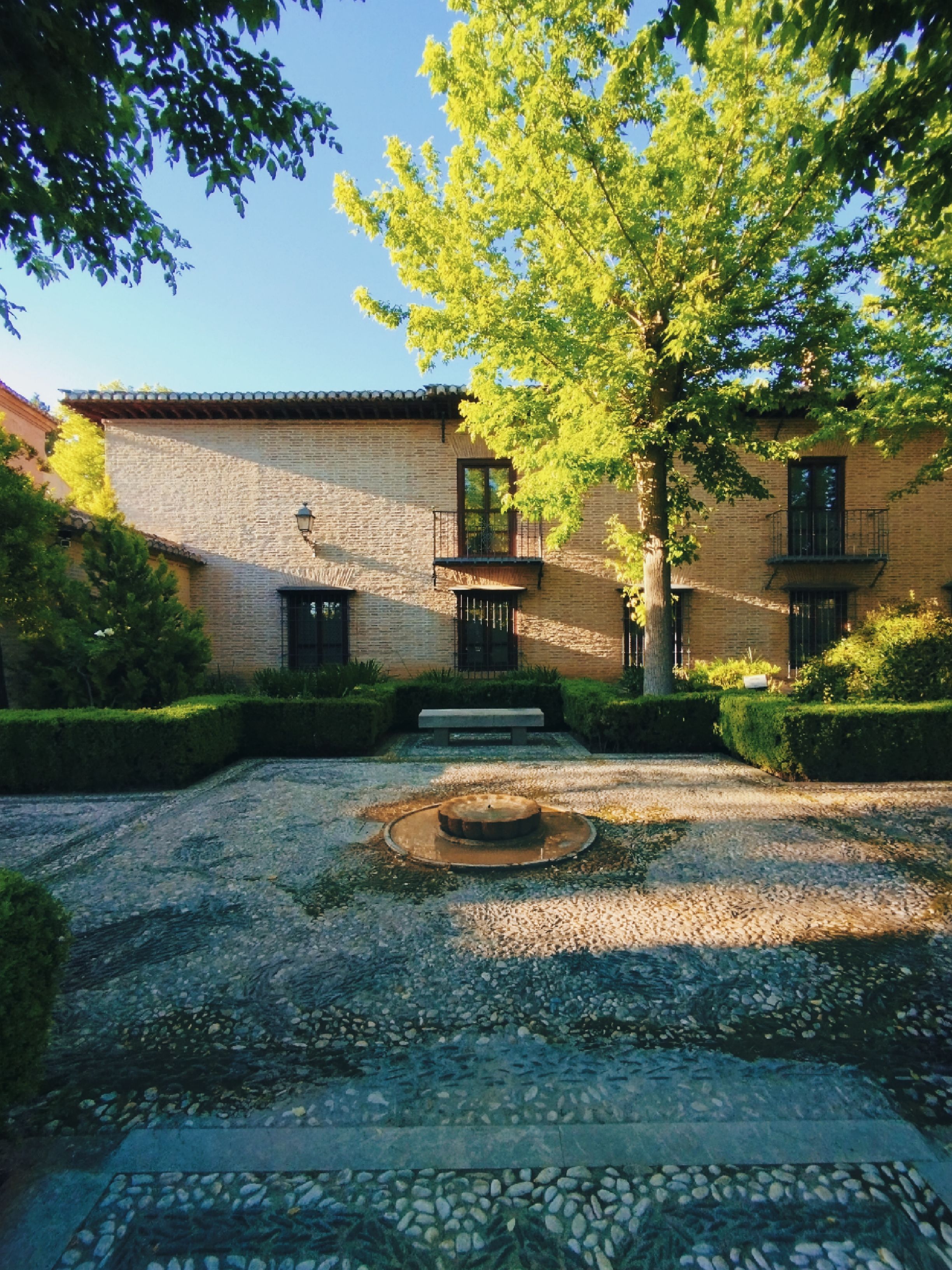 A Concrete House Near the Green Trees · Free Stock Photo