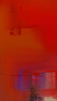 A vibrant abstract painting featuring bold red and purple hues with textured surface details.