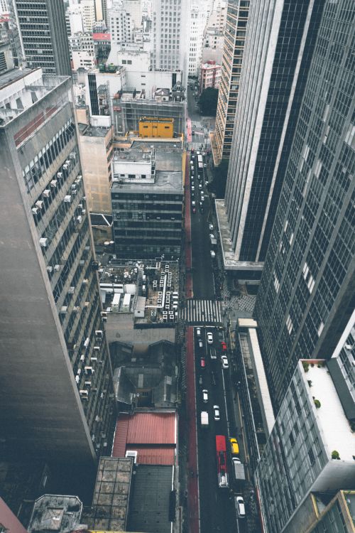 Free High-angle cityscape showing bustling streets and towering skyscrapers in an urban environment. Stock Photo