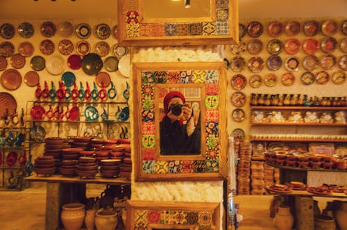 A woman taking a picture of herself in a store