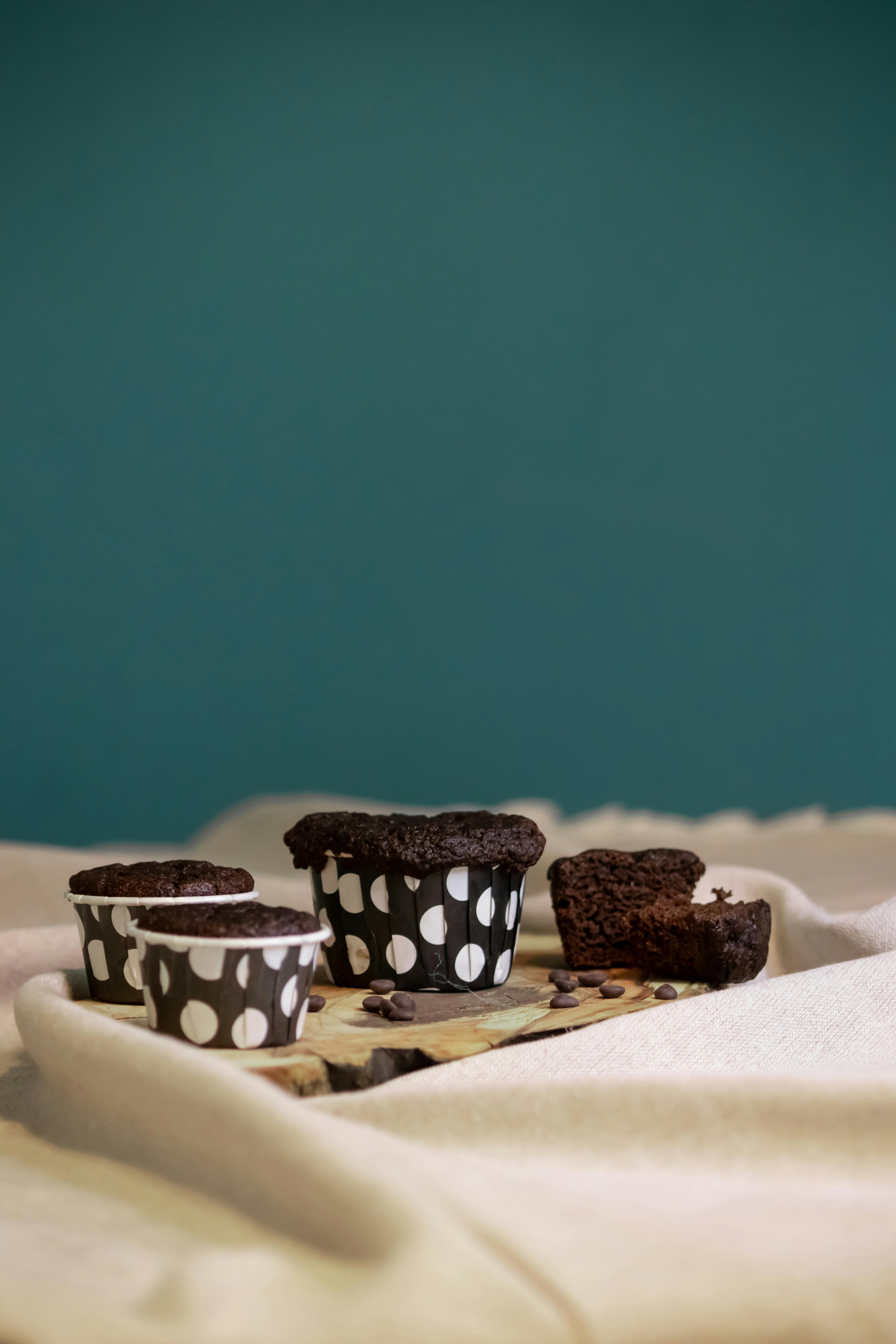 Chocolate Cupcakes in Paper Cups on a Board · Free Stock Photo