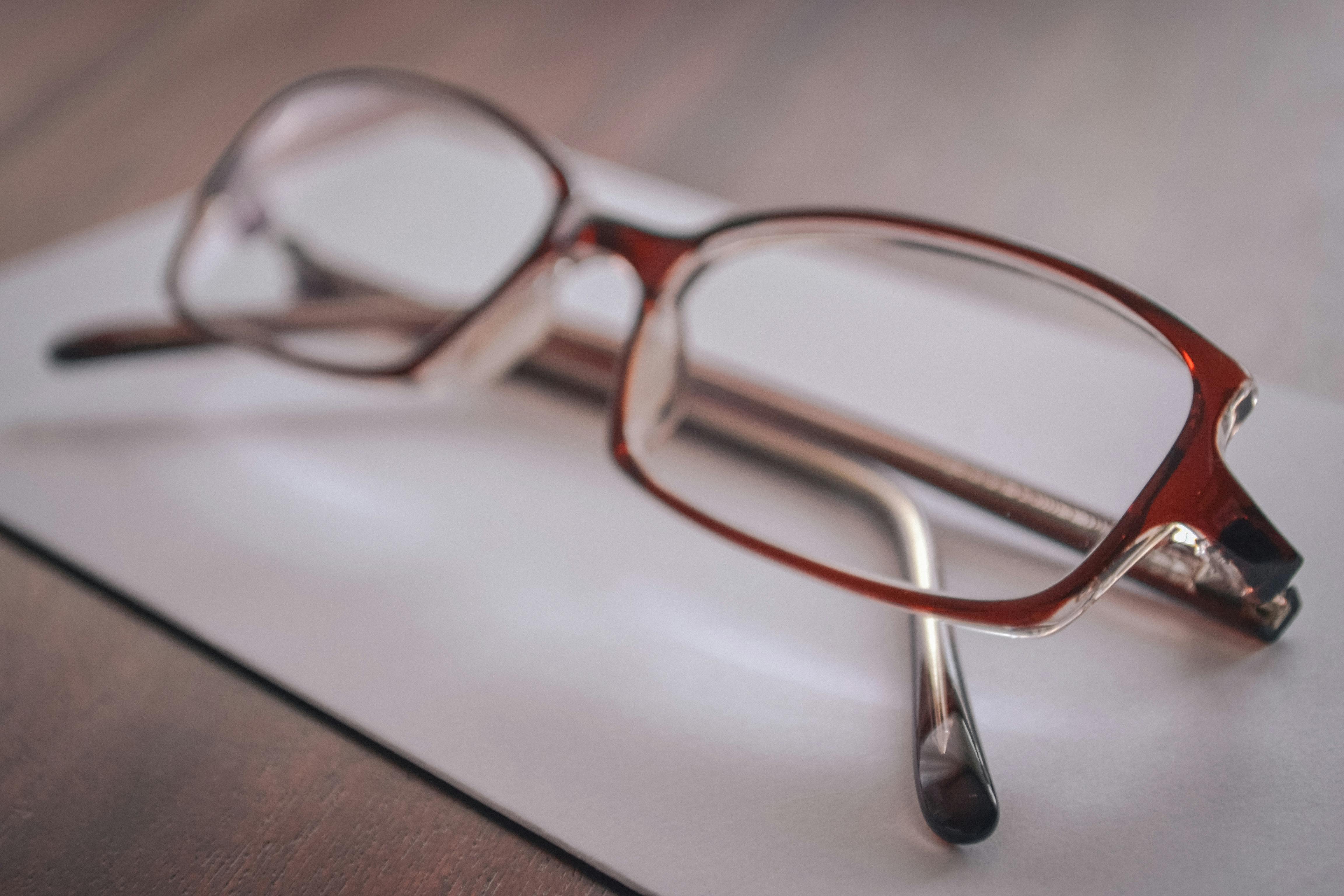 Eyeglasses on Paper · Free Stock Photo