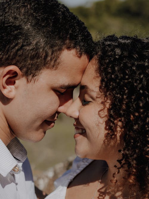 Sunlit Couple Faces