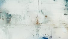 A painting with white and blue paint on it