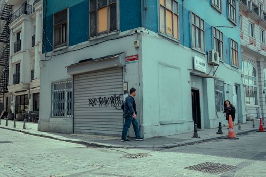 Vibrant street scene in Istanbul showcasing pedestrians and colorful buildings.