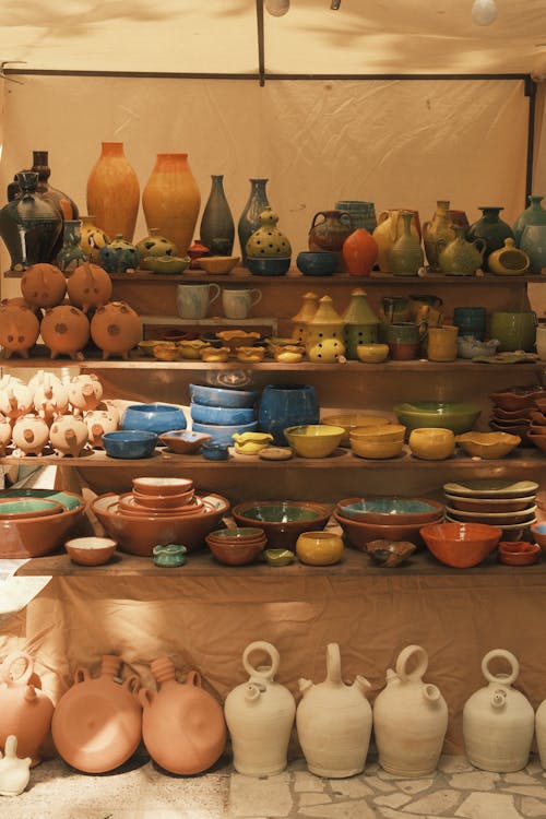 A display of pottery and other items on a table