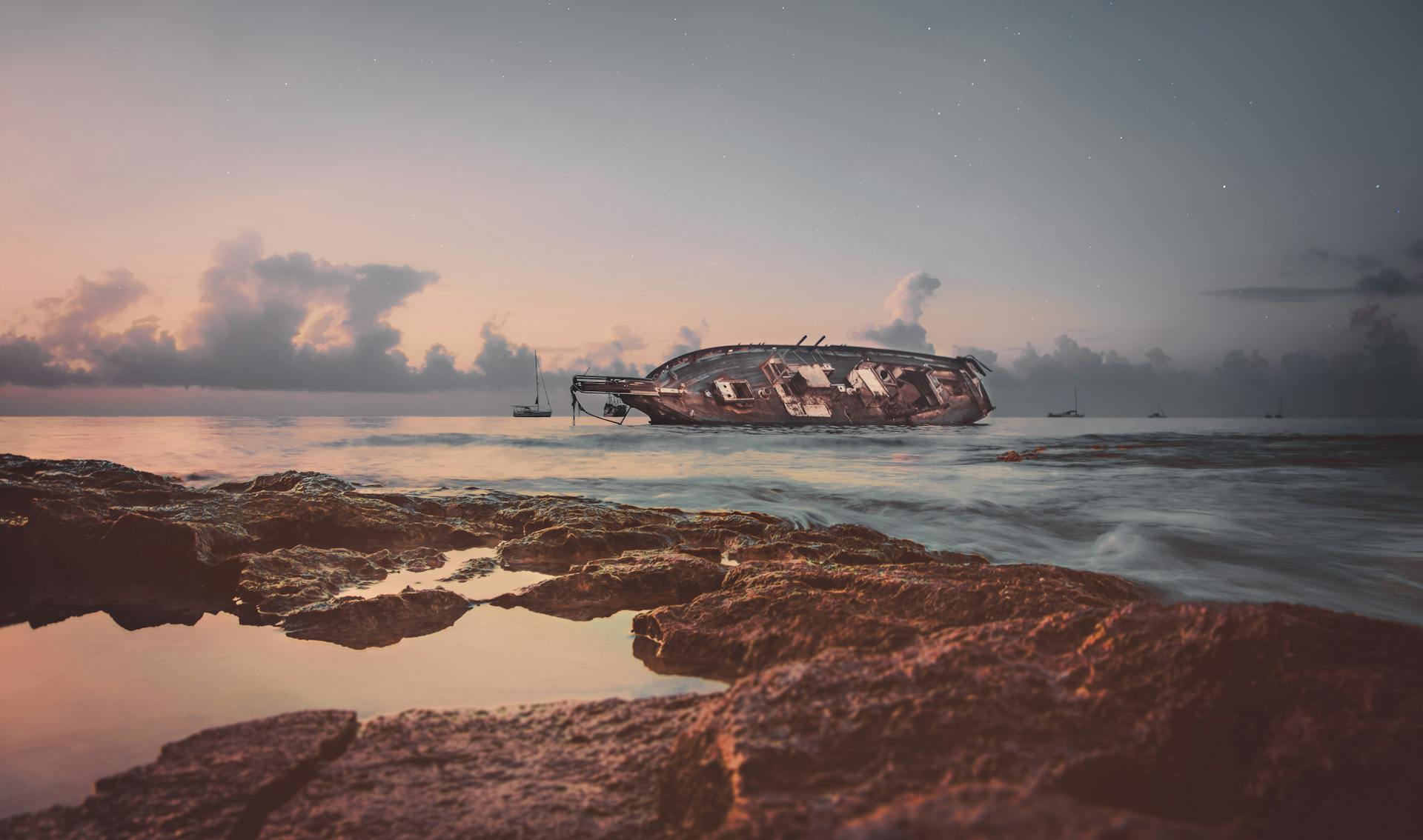 Dramatic view of a shipwreck at sunrise off the coast of Cozumel, Mexico.